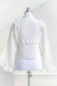 A romantic, vintage-inspired top, the Odette blouse features semi-sheer eyelet lace, ruffle details, long sleeves, a cropped length, and high neckline with bow detailing. Please Note- This item is final sale only. . Details: S: Bust 33", Length 18" M: Bust 35", Length 18.5" L: Bust 37", Length 19" Length Measured from Shoulder Unlined Material: 65% Rayon, 35% Polyester Imported Gentle Wash Cold / Line Dry Cottagecore Outfit, Cottagecore Outfits, Romantic Mood, Romantic Dress, Eyelet Lace, Lace Ruffle, French Girl, French Fashion, Lace Blouse