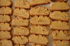 a bunch of cookies that are sitting on a counter top with some nuts in the middle