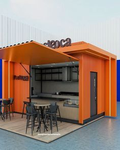 an orange and black food stand with stools