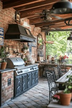 Outdoor rustic kitchen with brick walls, black metal grill, and a wooden dining table. Foldable Furniture, Grill Station