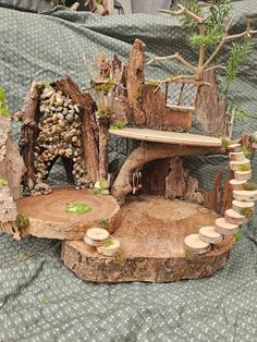 a miniature tree house made out of logs