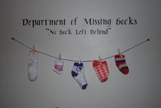 several socks hanging on a clothes line with the caption department of missing socks no back left behind