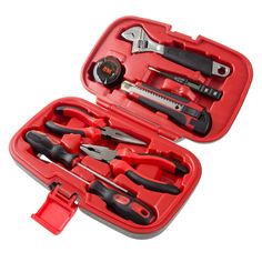 a red tool case filled with tools on top of a white surface