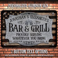 a bar and grill sign on a brick wall