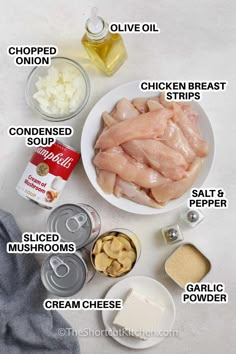 ingredients to make chicken broth on a white table