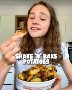 a woman holding a bowl of food with the words shake n'bake potatoes