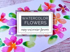 watercolor flowers on white paper with text overlay that says easy watercolor flowers