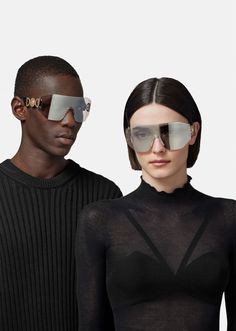 These wide sunglasses feature Medusa Biggie hardware at the temples and are accented with a logo at the nose bridge. Designer Anti-reflective Sunglasses, Rimless Shield Sunglasses With Mirrored Lenses, Designer Anti-reflective Glass Sunglasses, Designer Glass Sunglasses With Anti-reflective Coating, Rimless Glass Shield Sunglasses With Tinted Lenses, Luxury Shield Sunglasses With Gradient Lenses, Designer Shield Sunglasses With Uv Protection Square Frame, Elegant Anti-reflective Shield Sunglasses, Luxury Shield Sunglasses With Gradient Glass Lenses