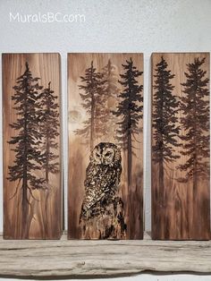 three wooden paintings depicting an owl in the woods