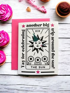 a card with an image of the sun surrounded by cupcakes and sprinkles