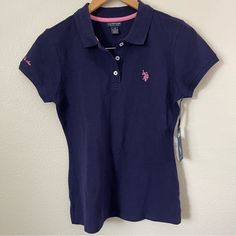 U.S. Polo Assn. Women’s Polo Shirt Short Sleeve Navy Blue With Pink Size M Color: Navy Blue With Pink Detail Condition: New With Tags, No Flaws Details: Collared Shirt With Buttons Material: 100% Cotton Smoke Free And Pet Free Home * I Bundle* Pink Polo Shirt, Shirt With Buttons, Navy Polo Shirt, Polo Blouse, Polo Women, Casual Shirt Women, Polo Shirt White, Short Sleeve Hoodie, Polo Blue