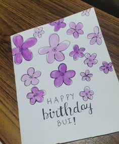 a birthday card with purple flowers on it