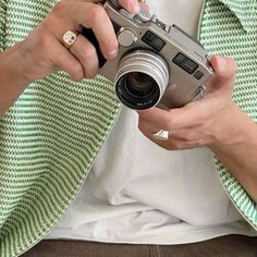 a man holding a camera in his hands