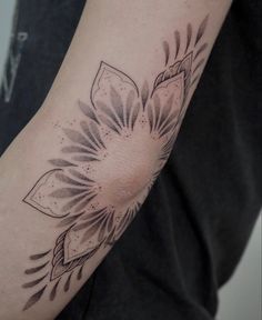 a person with a tattoo on their arm