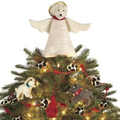 a christmas tree with an angel decoration on top