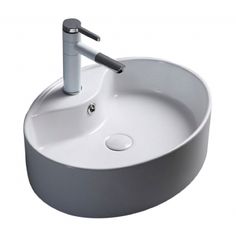 a white round sink with chrome faucet