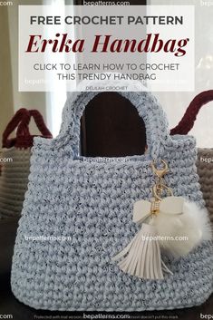 a crocheted purse with a tassell hanging from the front and side