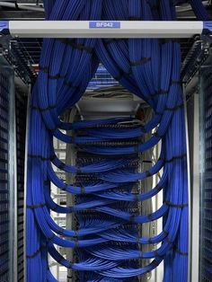 the inside of a server with many blue wires