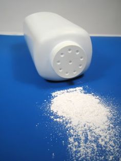 white powder is sitting on a blue surface