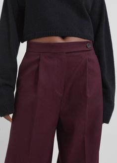 Color: Burgundy Midweight woven fabric Regular fit Wide leg Mid-rise Belt loops Side seam pockets Back illusion welt pockets Zip fly Asymmetric front button closure Unlined 77% Polyester 21% Rayon 2% Elastane Dry Clean By The Frankie Shop. Imported The Frankie Shop, Frankie Shop, Wide Leg Trousers, Welt Pockets, Welt Pocket, Woven Fabric, Mid Rise, Wide Leg, Dry Clean