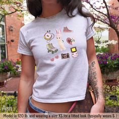 ⭐️ Get ready to fall in love with our Sonny Angel Baby Tee!  ⭐️ This adorable 90's Crop Top brings back all the nostalgic vibes of retro fashion.  ⭐️ Perfect for anyone who's into that Y2K baby tee style, this retro trendy baby tshirt will give you all the feels of a classic yet trendy look.  ⭐️ Whether you're channeling your inner coquette or just want a cute graphic tee to add to your collection, this one's a must-have.  ⭐️ It's snug, stylish, and oh-so-cute--grab yours now and rock that throw 90s Cartoon Print Tops For Spring, Cute Custom Print T-shirt For Streetwear, Cute Crew Neck Tops For Streetwear, Cute Streetwear Crew Neck Tops, Cute Crew Neck Streetwear Tops, 90s Funny Print Tops For Streetwear, Unisex 90s Style Short Sleeve Tops, Cute Funny Print T-shirt For Streetwear, Cute Funny Print T-shirt For Everyday