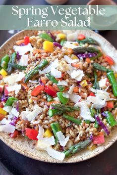 a plate filled with rice and vegetables on top of a table