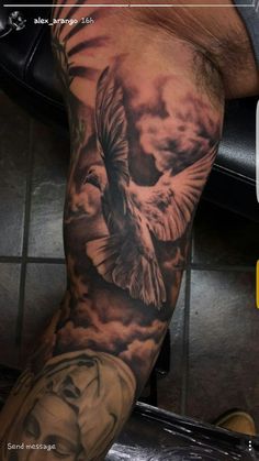 a man's arm with a bird on it