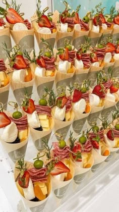 an assortment of appetizers are arranged on display