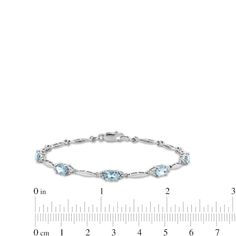 Dress the March birthday girl's wrist in a sparkling gemstone fashion bracelet she'll love. Crafted in sterling silver, this demure design features 6.0 x 4.0mm oval-shaped icy-blue aquamarines alternating with polished links. Diamond accents lend shimmer to the look. Buffed to a brilliant luster, this 7.25-inch bracelet secures with a durable lobster claw clasp. Oval Link Gemstone Bracelets For Anniversary, Classic Sterling Silver Bracelet With Oval Gemstone, Classic Sterling Silver Oval Gemstone Bracelet, Classic Oval Gemstone Sterling Silver Bracelet, Sterling Silver Oval Gemstone Bracelet For Anniversary, Oval Sterling Silver Bracelet With Gemstone For Anniversary, Oval Gemstone Accent Bracelets For Anniversary, Formal Oval Bracelets With Birthstone, Oval Sterling Silver Bracelet Fine Jewelry