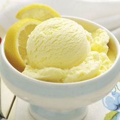 a white bowl filled with lemon ice cream