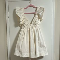 Baby Doll White Dress, Never Worn. With Tag. Tried On But Never Wore And Never Returned Because I Forgot! Size Small - Runs True To Size With Room Because It Has Stretchy Band Chic Off-white Cotton Mini Dress, Cute Off White Ruffled Dress, Cute Off White Dress With Ruffles, Cute Off-white Ruffled Dresses, Off White A-line Mini Dress For Brunch, Cotton A-line Mini Dress For Brunch, Summer Ruffle Dress In Off White, Cream Cotton Mini Dress For Brunch, Beige Cotton Mini Dress For Party