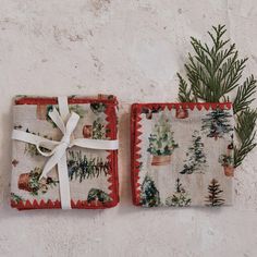 two place mats with christmas trees on them