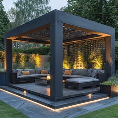 an outdoor living area with couches and lights