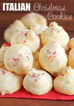 italian christmas cookies with white frosting and sprinkles on a red napkin