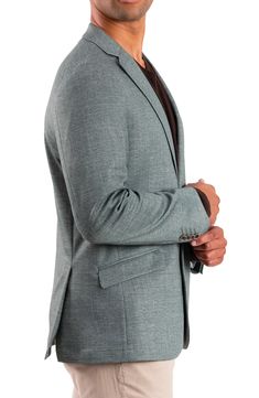 A solid hue distinguishes this woven sport coat that'll make a dapper statement to top off any look. Two-button closure Notched lapels Chest welt pocket; front flap welt pockets 90% polyester, 5% rayon, 5% elastane Dry clean Imported Tailored Sport Coat For Business Casual, Fitted Blazer With Pocket Square And Suit Collar, Fitted Business Blazer With Pocket Square, Tailored Notch Lapel Blazer With Pocket Square, Tailored Blazer With Notch Lapel And Pocket Square, Tailored Blazer With Pocket Square And Notch Lapel, Tailored Solid Color Semi-formal Blazer, Spring Business Sport Coat With Suit Collar, Tailored Solid Color Blazer For Semi-formal Events