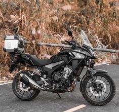 a black motorcycle parked on the side of the road