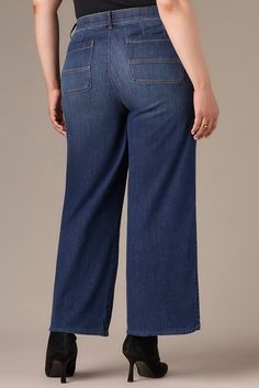 These indigo Whitney Wide Leg jeans with a tulip hem in plus sizing are a statement silhouette. They're designed with front and back paneling, a skyrise waist, four-pocket styling with curved front pockets, and subtle fading and whiskering details. • Jeans for curvy women• Indigo• Tri-blend stretch denim• 1% spandex• Button and zip fly closure• Four-pocket styling with curved front pockets• Front and back paneling• Subtle fading and whiskering details• Wide tulip hem #LHG2580L8 Jeans For Curvy Women, Wide Leg Plus Size, Missy Dresses, Denim Workwear, Indigo Denim, Blouse Short Sleeve, Petite Jeans, Plus Size Jeans, New Tops