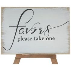 a wooden sign that says favors please take one on top of an easel with the word