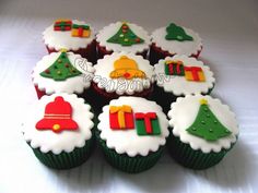 cupcakes decorated with christmas decorations and trees