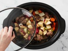 someone is cooking food in the slow cooker