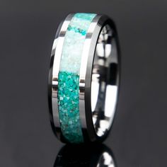 Features Strong and highly scratch resistant tungsten band 8mm Width Natural turquoise stone inlay Water resistant Comfort fit interior Beveled edges Can be customized with different metals and materials Handcrafted Ideal for promise rings, men's wedding bands, gifts, and more Turquoise White Opal Ring Men, Luxury Turquoise Men's Engagement Ring, Luxury Elegant Turquoise Men's Ring, Mens Turquiose Rings, Luxury Elegant Men's Turquoise Ring, Turquoise Man Ring, Luxury Handmade Men's Turquoise Ring, Luxury Men's Polished Turquoise Ring, Luxury Men's Turquoise Ring