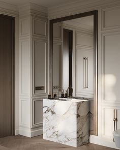 a bathroom with marble counter tops and white cabinets in the corner, along with a urinal