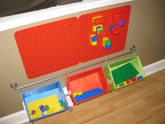 three storage bins with lego blocks on them