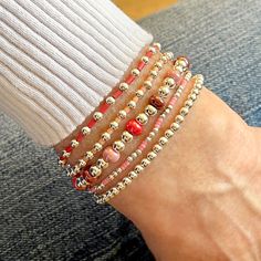 14K gold-filled or sterling silver 2mm, 3mm, & 4mm beads; colorful glass seed beads; 6mm glass bubble beads; stretch style. Water safe, tarnish-resistant. Great solo or stacked. Bracelet Size Guide