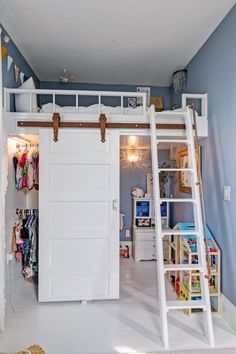 there is a loft bed with a ladder in the room