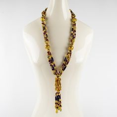 This is part of Chairish’s Costume Jewelry assortment.  Spectacular one-of-a-kind Christian Dior runway couture necklace. Extra-long multi-strand shape with dangling tassel. The necklace is all built with hand-blown Murano, Italy art glass beads and complemented with gilt metal carved spacers. This necklace was made for a Dior runway show in Paris in the 1980s as a prototype and was never turned into a ready-to-wear produced piece. The quality of each large carved bead is gorgeous with gold appl Elegant Multicolor Long Necklace For Party, Elegant Yellow Multi-strand Necklace, Elegant Multicolor Lariat Necklace, Elegant Multicolor Lariat Beaded Necklace, Elegant Multicolor Lariat Beaded Necklaces, Luxury Long Necklace For Party, Christian Dior Runway, Dior Runway, Couture Necklace