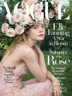 a magazine with an image of a woman wearing flowers on the cover