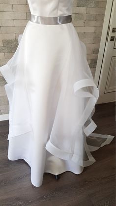 Diamond shaped asymmetric organza wedding train with horsehair hem - a truly elegant and unique adding to your bridal gown. Only high quality fabrics and high finishing used for making the wedding skirt as neat as it can be. the length is customizable. For more wedding skirts, please access https://www.etsy.com/shop/LidiasBoutiqueDesign?ref=seller-platform-mcnav&section_id=23168823. For more wedding tops and boleros, please access https://www.etsy.com/shop/LidiasBoutiqueDesign?ref=seller-pla White Organza Gown With Sweep Train, Elegant Wedding Dress With Asymmetrical Skirt, Wedding Gown With Organza Tulle Skirt, Elegant Bridal Organza Gown, Floor-length Organza Tulle For Wedding, Elegant Organza Bride Gown, Fitted Organza Gown With Long Train, Elegant Organza Gown For Bride, Elegant Tulle Skirt With Long Train