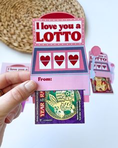 someone is holding up a card that says i love you a lotto