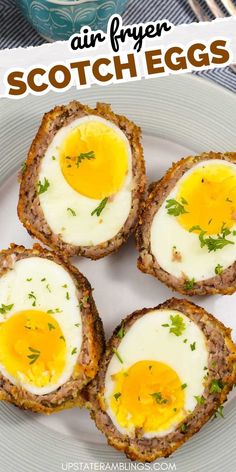 four scotch eggs on a white plate with text overlay that reads air fryer scotch eggs